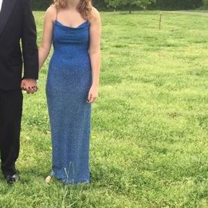 A dark blue sparkling dress with slit